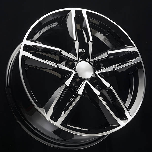 new shiny sports alloy wheel in the shape of a star on a black background